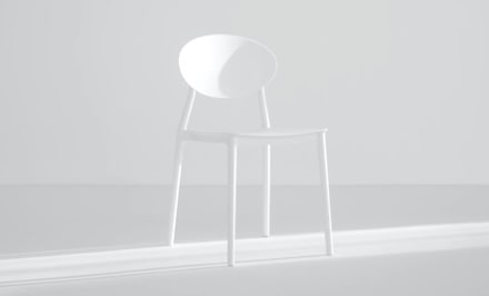 A light themed environment with white a chair